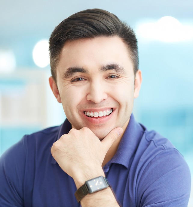 smiling young man wearing braces